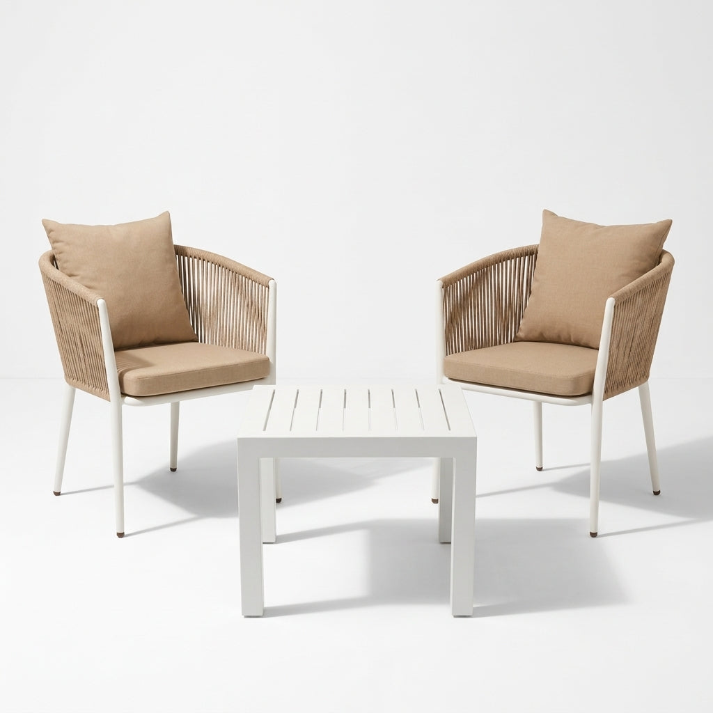 Two beige armchairs with woven backs and a matching white slatted coffee table, arranged on a clean white studio background.
